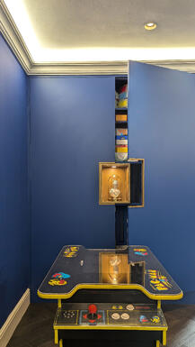 Electric blue bespoke handleless cabinets with gold centrepiece